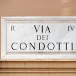 Via dei Condotti street sign on wall in Rome