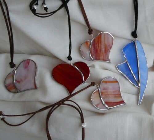 Learn how to work stained glass and make your own pendant to take home with you in Rome's Trastevere neighborhood.