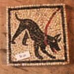 Mosaic-tile,-Black-dog-with-red-leash