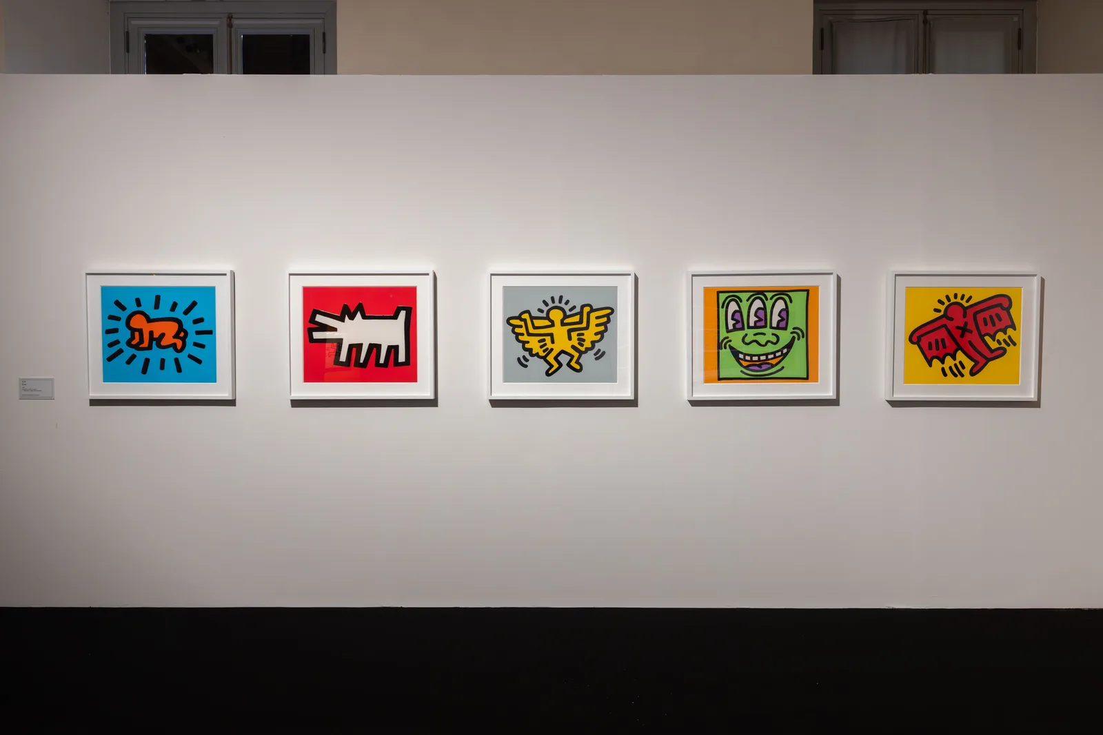 Five prints from Keith Haring’s Icons series, including the Radiant Baby and the Barking Dog, at Palazzo Braschi