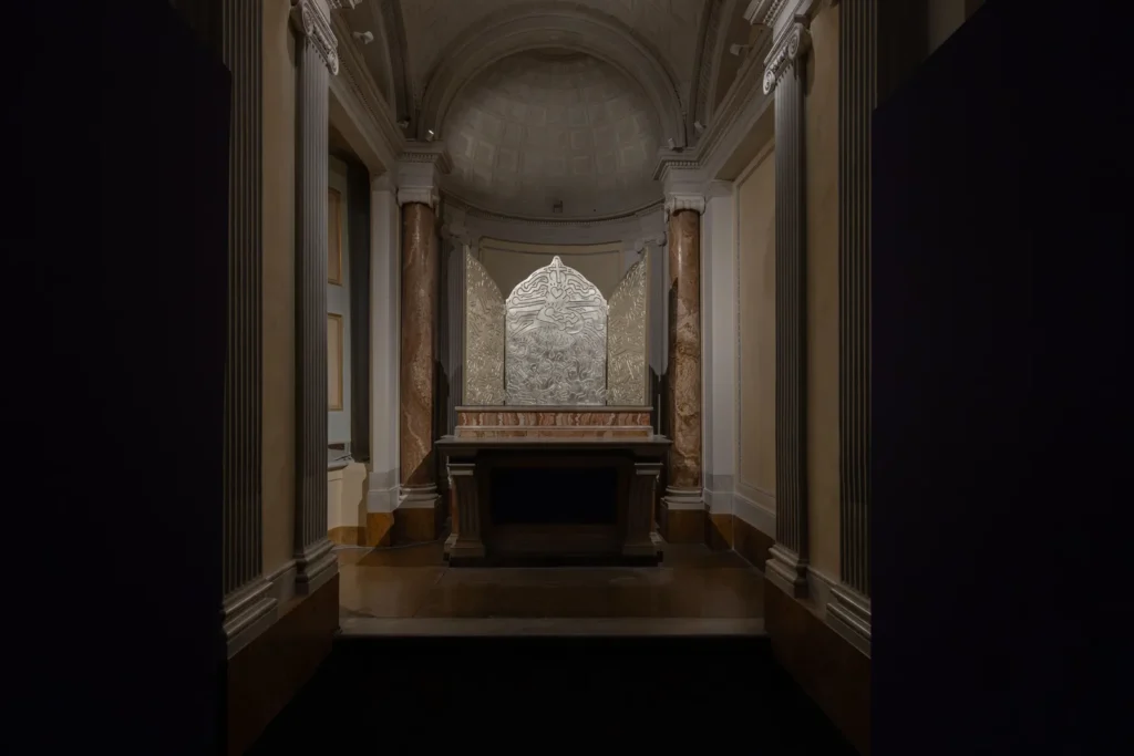 Keith Haring's Altarpiece: The Life of Christ, a silver triptych displayed in the chapel of Palazzo Braschi