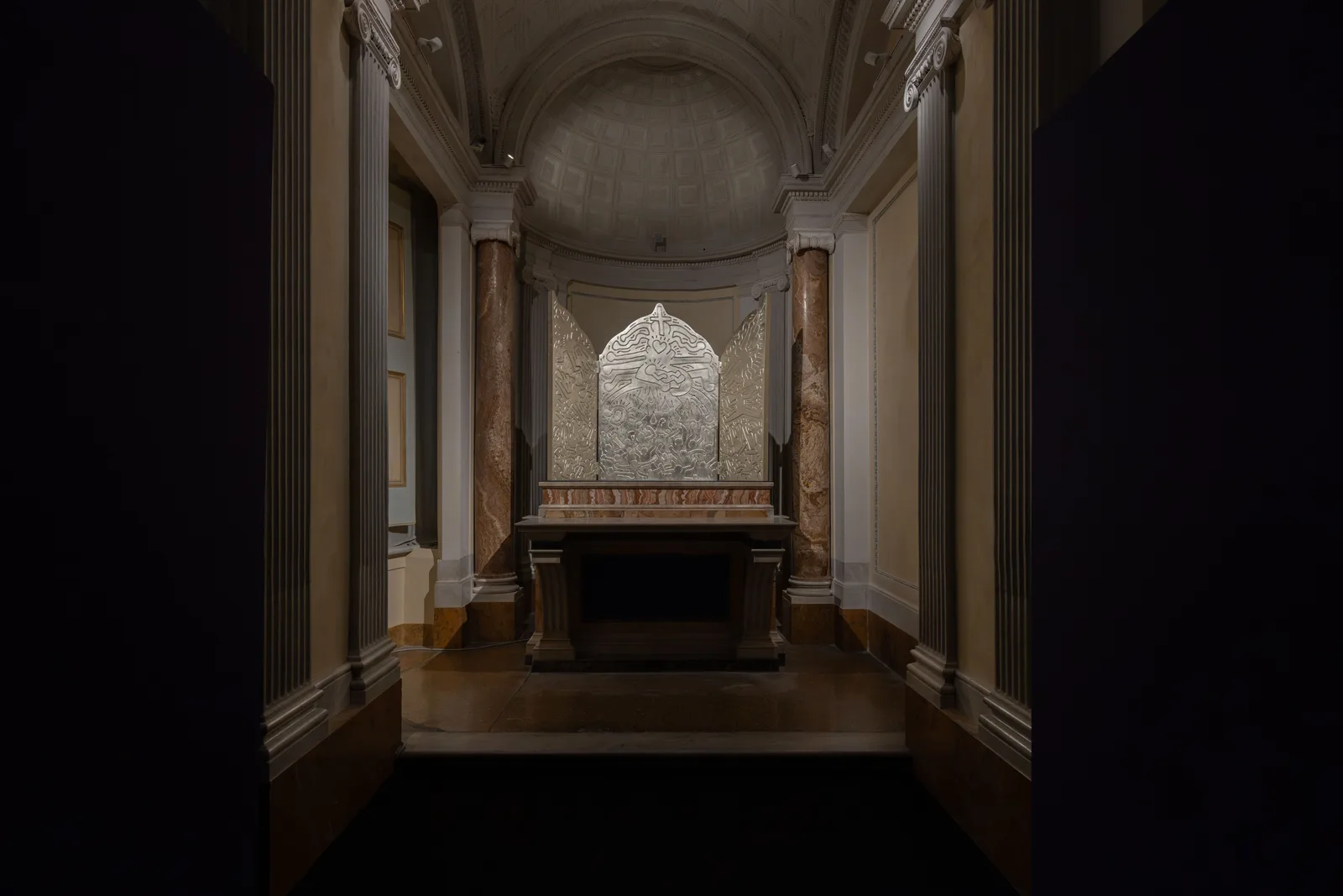 Keith Haring’s Altarpiece: The Life of Christ, a silver triptych displayed in the chapel of Palazzo Braschi