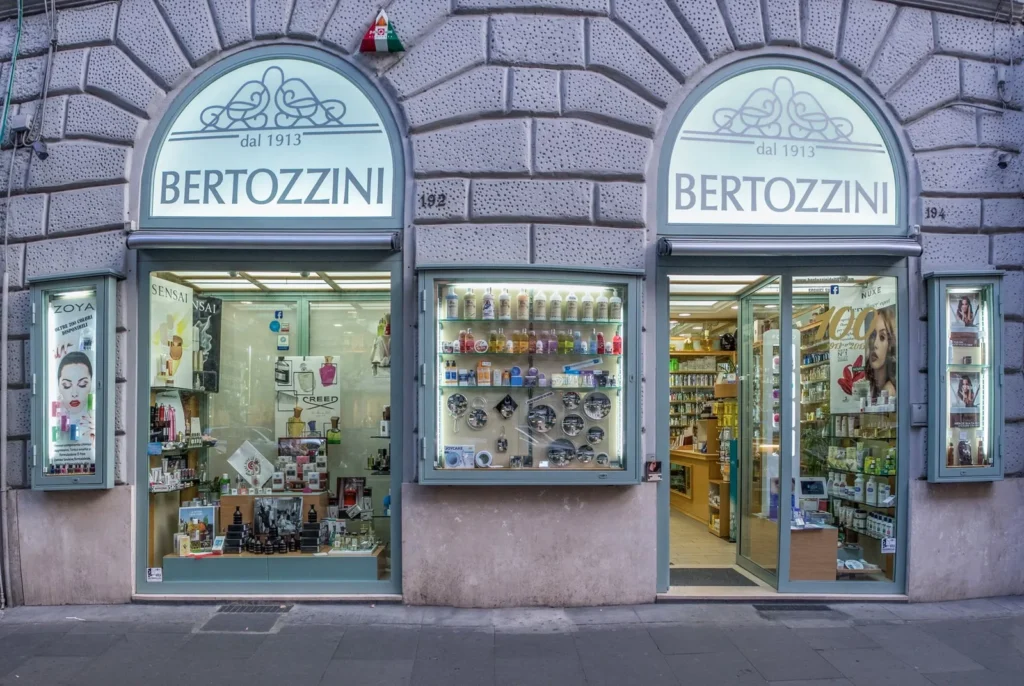 Fragrance shelves inside Bertozzini dal 1913 artistic perfumery on Via Cola di Rienzo, Prati