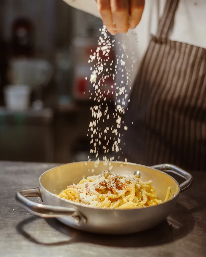 Tonnarelli with pecorino and guanciale prepared in the kitchen of Osteria Oliva in Rome