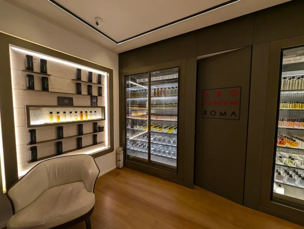 Laboratory-style fragrance display at the back of a Profumum Roma store